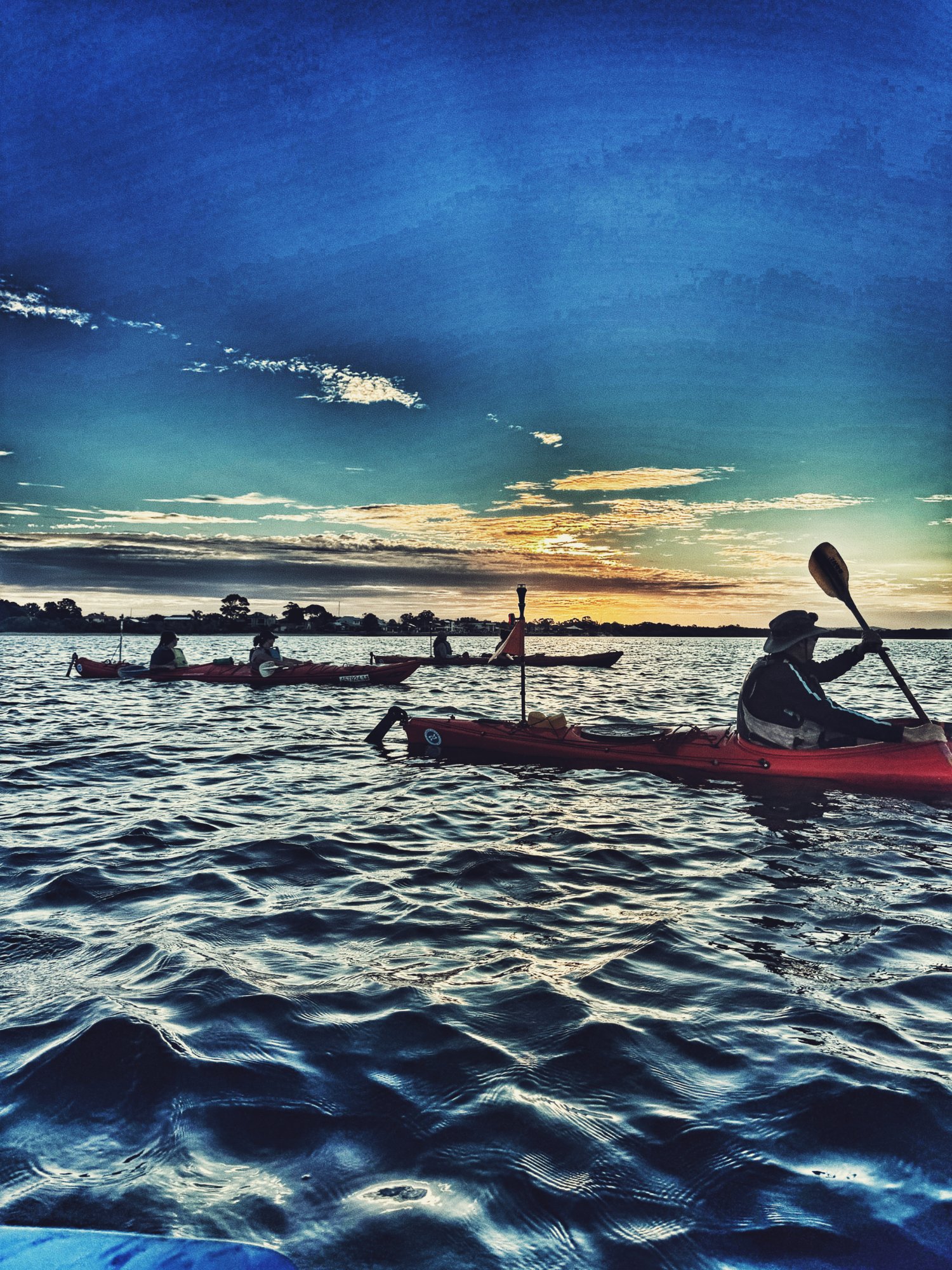 Kayaking on the Clarence River at sunset with Yamba Kayak